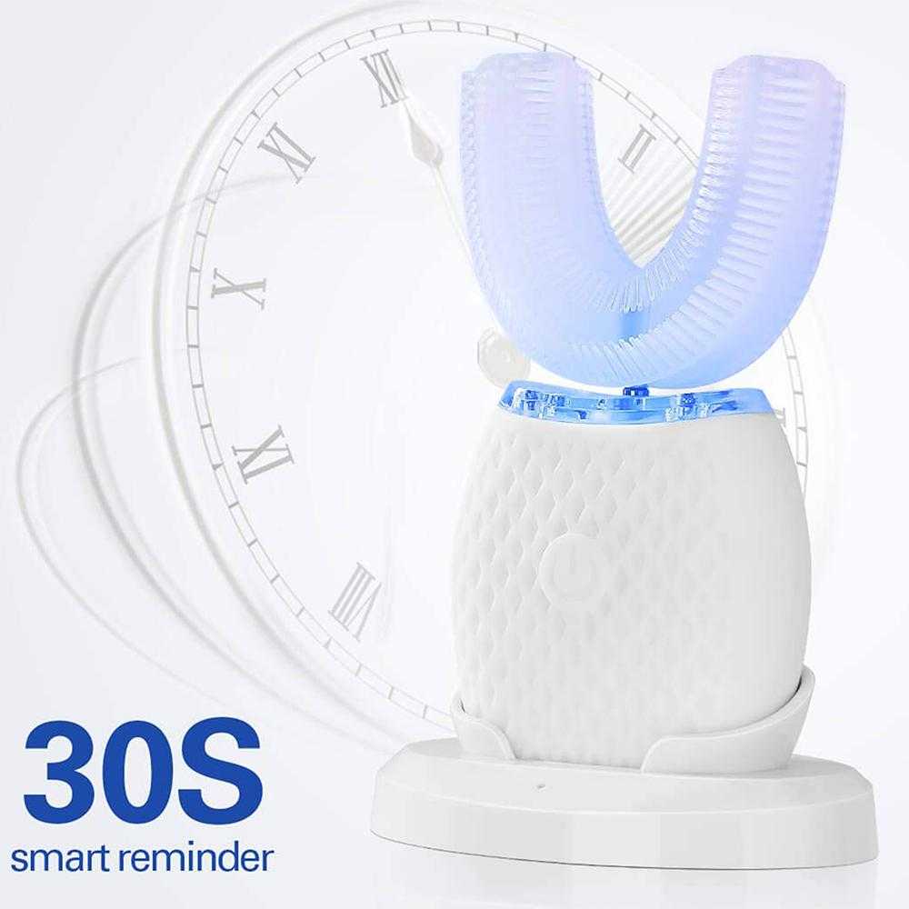 U-Shaped Toothbrush with LED light on charging base against clock background.