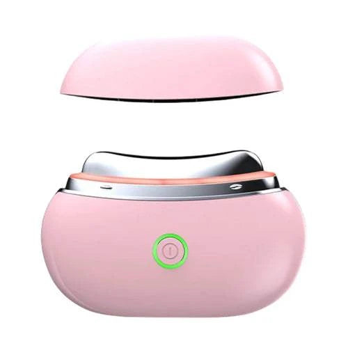 Portable Gua Sha face massager with light therapy in pink, wireless and compact design.
