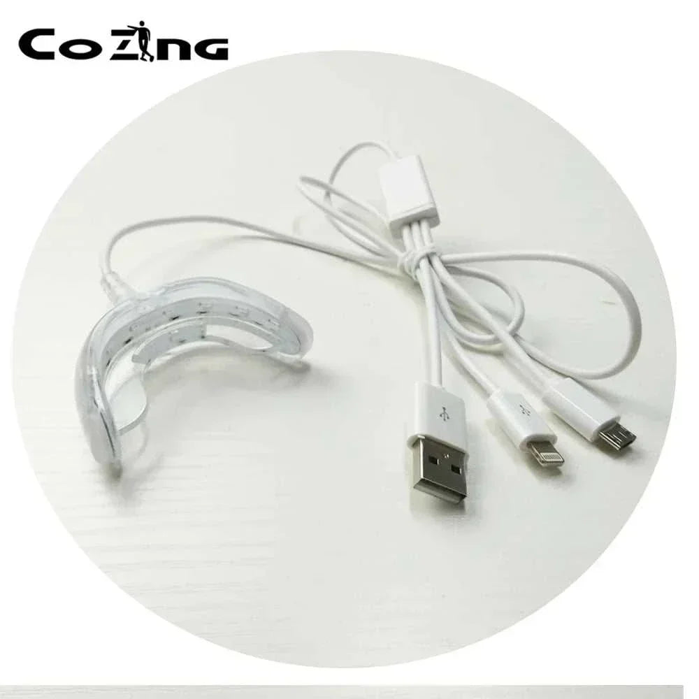 Portable handheld red light infrared therapy device with USB connections for at-home oral health.