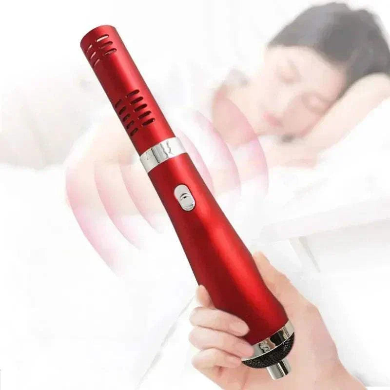 Red portable Terahertz therapy wand handheld device for heat therapy and pain relief with a blurred background of a sleeping woman.