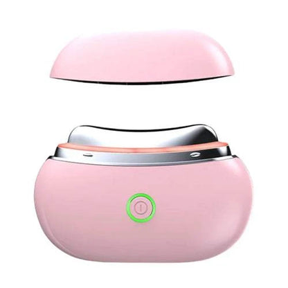 Portable Gua Sha face massager with light therapy in pink, wireless and compact design.