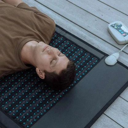 Electric PEMF massage mat with amethyst and jade, promoting relaxation and recovery.